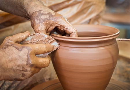Potter making a clay vase 