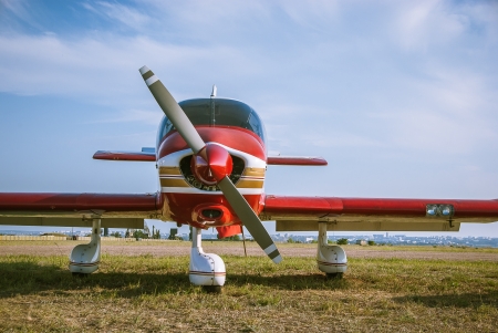 Red plane - propeller, wings and fuselage of the aircraftの写真素材