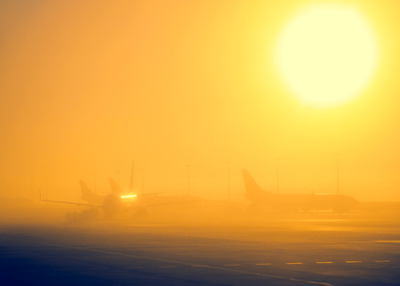 Foggy sunrise in airport.の写真素材