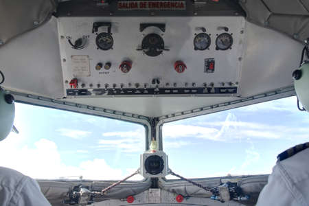 Cockpit top interior of DC3 in flight with pilots