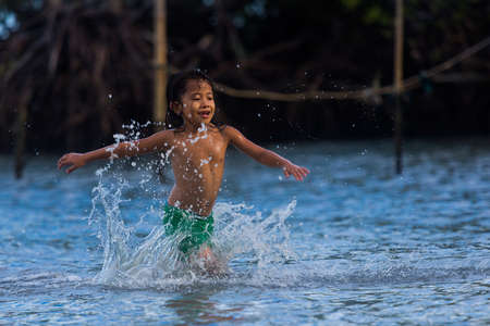 Philippines, Cebu Island, May 21, 2020. Filipino children have fun at sea.のeditorial素材