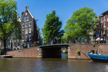 Amsterdam, Netherlands, Europe, September 1 2021 Traditional old narrow houses boats and canals in Amsterdam, the capital of the Netherlandsの写真素材