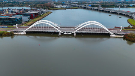Aerial drone view of modern Enneus Heerma Bridge Amsterdam Netherlands.の写真素材