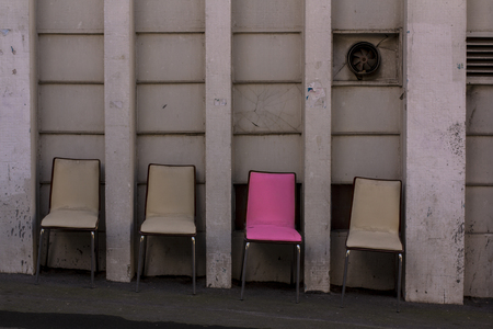 Four chairs and one is unique.の写真素材