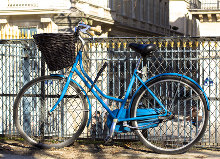 blue bicycle at the fenceの写真素材