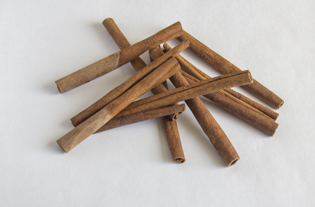 cinnamon sticks on white backgroundの写真素材