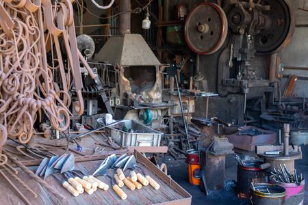 Metal processing workshop. Extinct Forge. Blacksmith Workplace. Miscellaneous hardware and iron...