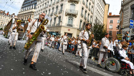 Lyon / France - September 16 2018: Biennial dance parade, colored groups parade in the streets of Lyonのeditorial素材