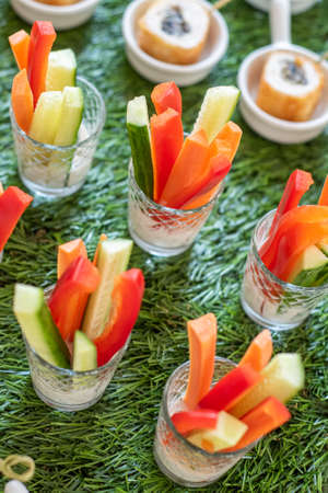 vegetable appetizer of carrots peppers and cucumbersの写真素材