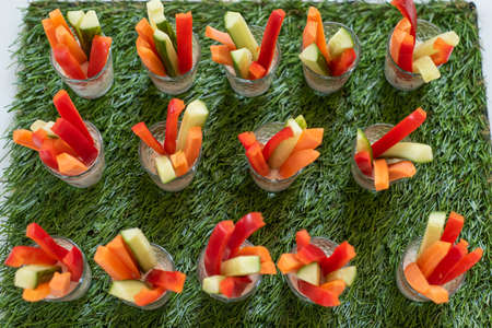 vegetable appetizer of carrots peppers and cucumbersの写真素材