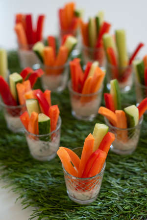 vegetable appetizer of carrots peppers and cucumbersの写真素材