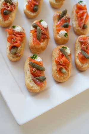 appetizer with fish on a white plateの写真素材