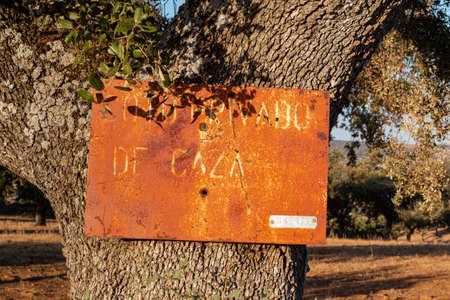 Hunting ground sign at sunset in southern Andalusia, Spainの写真素材