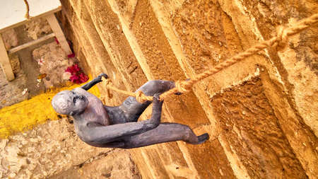 Figure of man climbing on the wall.の写真素材