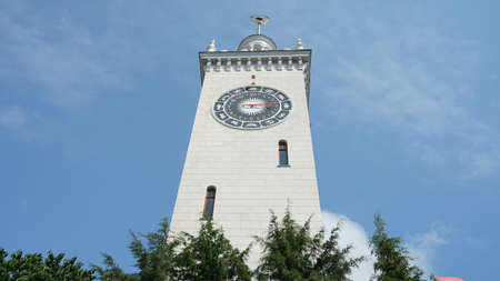 The clock tower of the Sochi railway station with a zodiac signs, Russia
