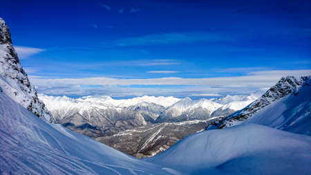 Aibga mountain peak covered by snow. Gorki Gorod ski resort. Sochi