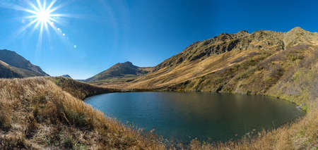 Mountain lake Maloe on sunny day, Krasnaya Polyana, Russia.の写真素材