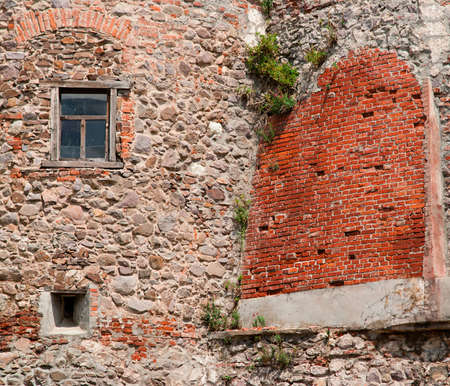 Wall of the old house, with a windowの写真素材