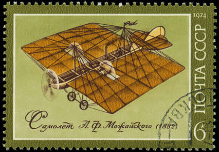 RUSSIA - CIRCA 1974  A stamp printed in USSR, show the first plane constructed Mozhaiskiy A F , circa 1974のeditorial素材