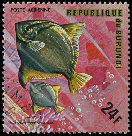 Republic of Burundi, - CIRCA 1975  A stamp printed by Burundi shows the fish Monodactylus argenteus,...
