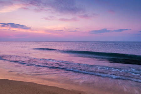 Beautiful seascape with orange warm sunrise, vacation conceptの写真素材