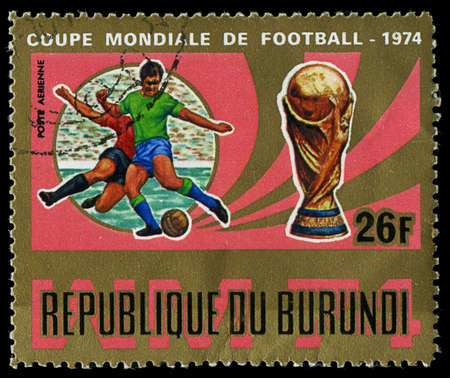 Republic of Burundi, - CIRCA 1974: A stamp printed by Burundi showing football players, circa 1974のeditorial素材