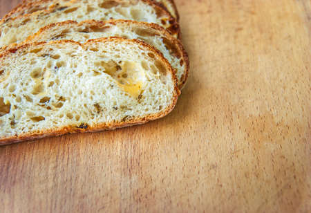Closeup of sliced bread on a chopping boardの写真素材