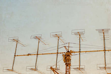 Military Radar under blue sky. Photo textured in old color image style.の写真素材