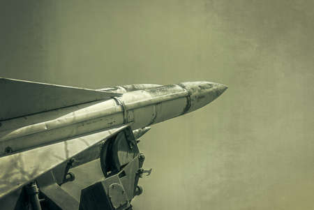 Old russian antiaircraft defense rocket launcher missiles. Grunge Army Missile.  Photo textured in old color image style.のeditorial素材