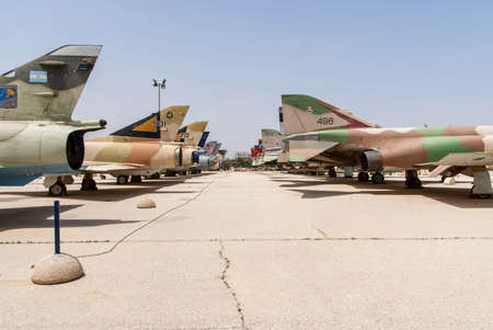 HATZERIM, ISRAEL - APRIL 27, 2015: Multiple types of military jets which served in IAF are displayed in Israeli Air Force Museum in Hatzerim, Israelのeditorial素材