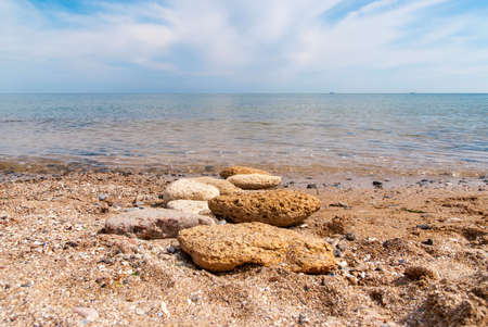 Stones on the beach, sunny summer day.の写真素材