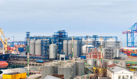 Cargo crane and grain dryer in port Odessaの写真素材