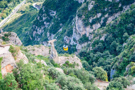 Yellow cable car in the Aeri de Montserrat rise to de Montserrat Abbey near Barcelona, Spain, Cataloniaの写真素材