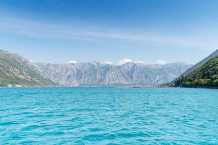 Scenic panoramic landscape view on Bay of Kotor, Montenegro with mountains at sundown.