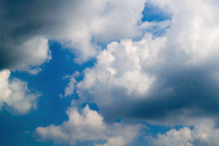 Texture of white clouds floating across the blue sky.の写真素材