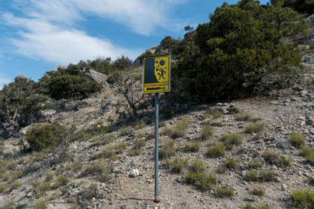 Warning sign on top of a mountainの写真素材