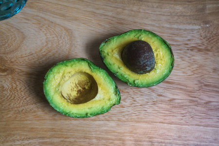 Avocado on a wooden table. Healthy food.の写真素材