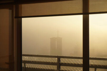 Morning mist in the window of the churchの写真素材