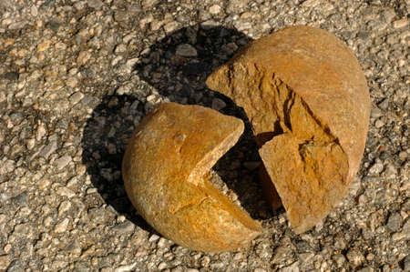 A broken rock in the shape of a lies beyond repairの写真素材