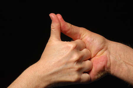 Thumb wrestle between two peopleの写真素材