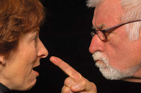 MAn and woman fight and point blameの写真素材