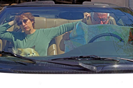 Couple lost in car, man won't ask directionsの写真素材