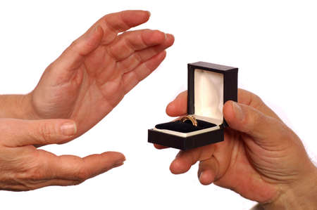 Man offers ring to womanの写真素材