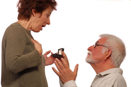 Man proposes on on knee to his loveの写真素材