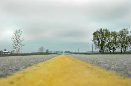 An ants eye view of a long highway road.の写真素材