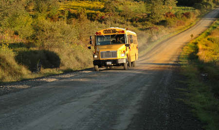 A country school bus makes it's way along its route