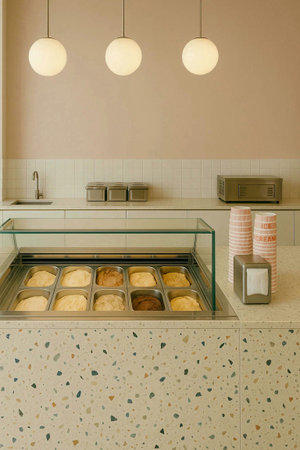 Coffee shop interior with cupcakes and coffee maker on counterの素材