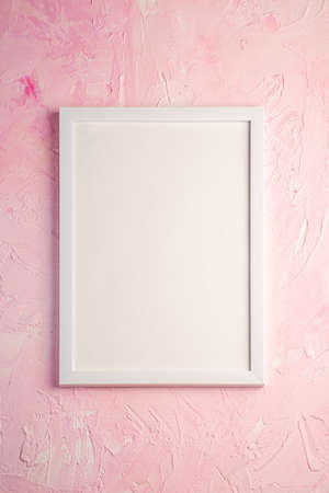 White empty template picture frame on textured bright, pink and peach background, top view, mockup copy spaceの写真素材