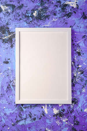 White empty template picture frame on textured blue and purple background, top view, mockup copy spaceの写真素材