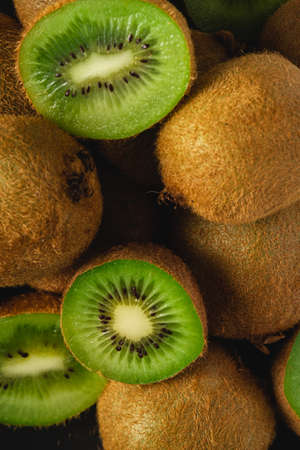 Kiwi fruit half sliced close up macro, healthy lifestyle and food, vibrant green colorの写真素材